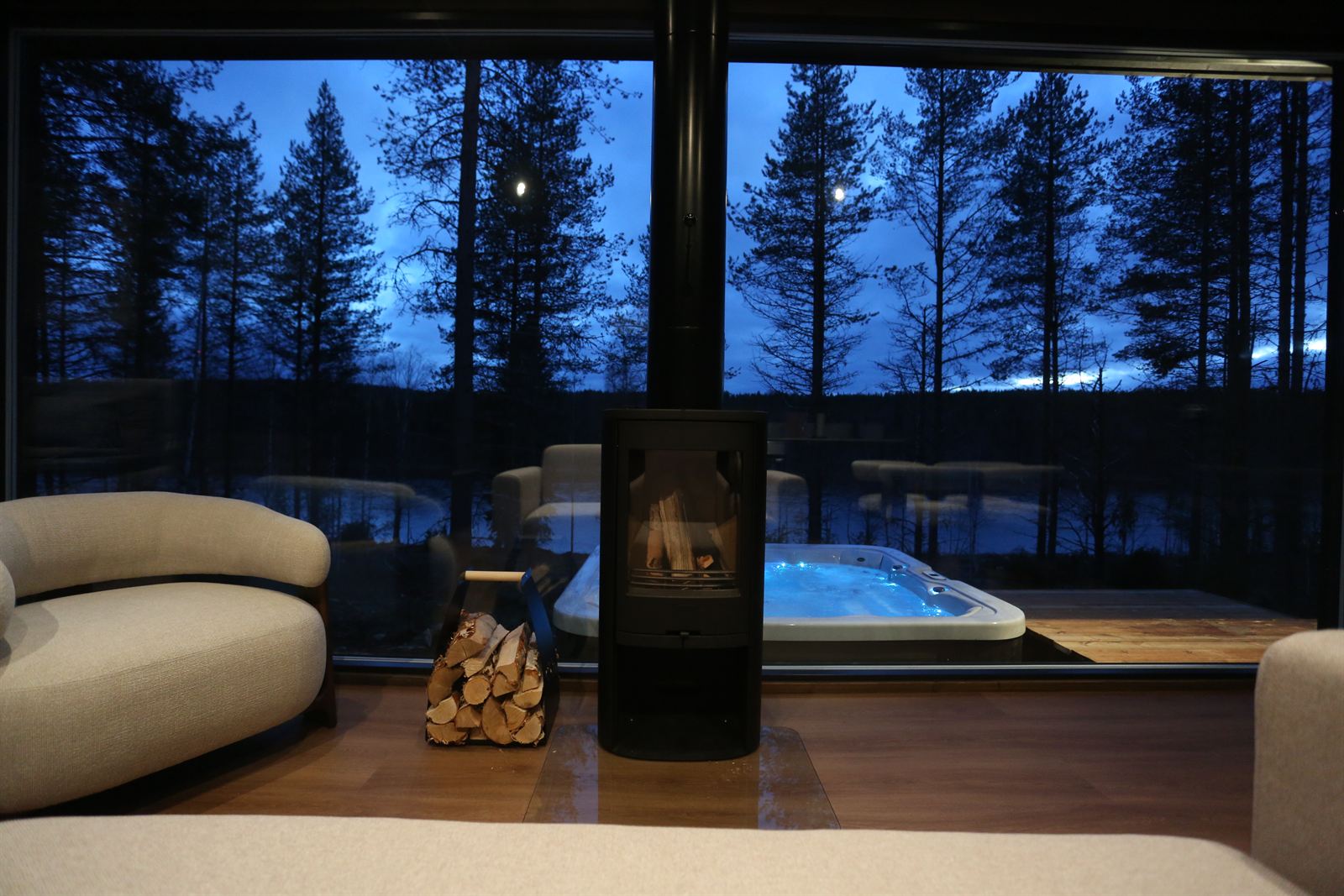 Lounge chairs, fire and the river at dusk