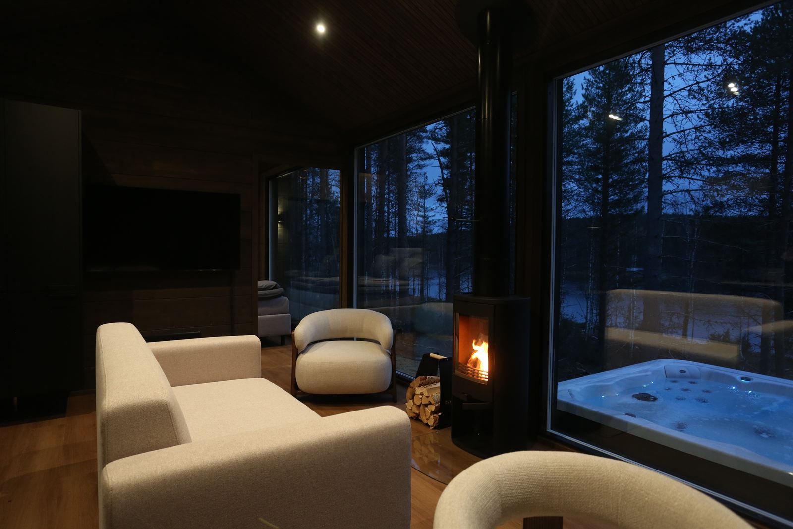 Sofa by the wood stove, hot tub outside